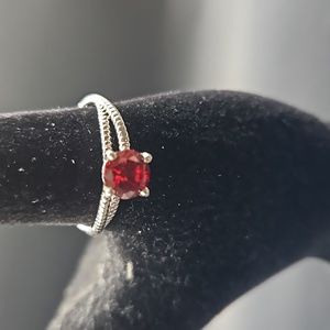 F-2 Silvertone ring with red solitaire